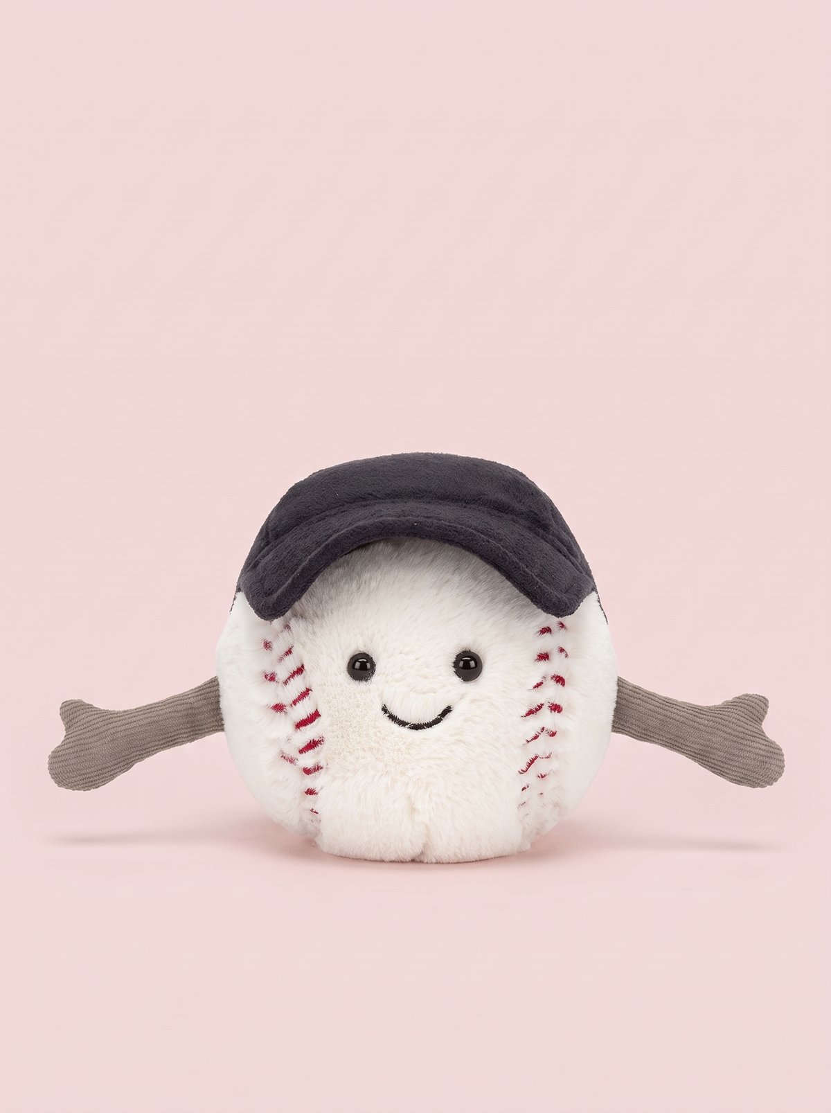 Baseball Plush Toy front view on a pink studio background