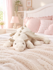 White Dragon Plush Toy on a bed in a bright children's bedroom