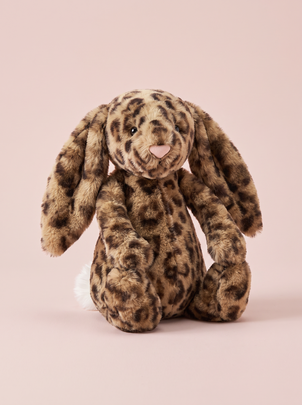 Leopard Print Bunny Plush Toy front view on a pink studio background