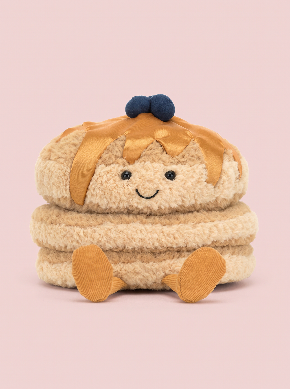 Pancake Stack Plush Toy front view on a pink studio background