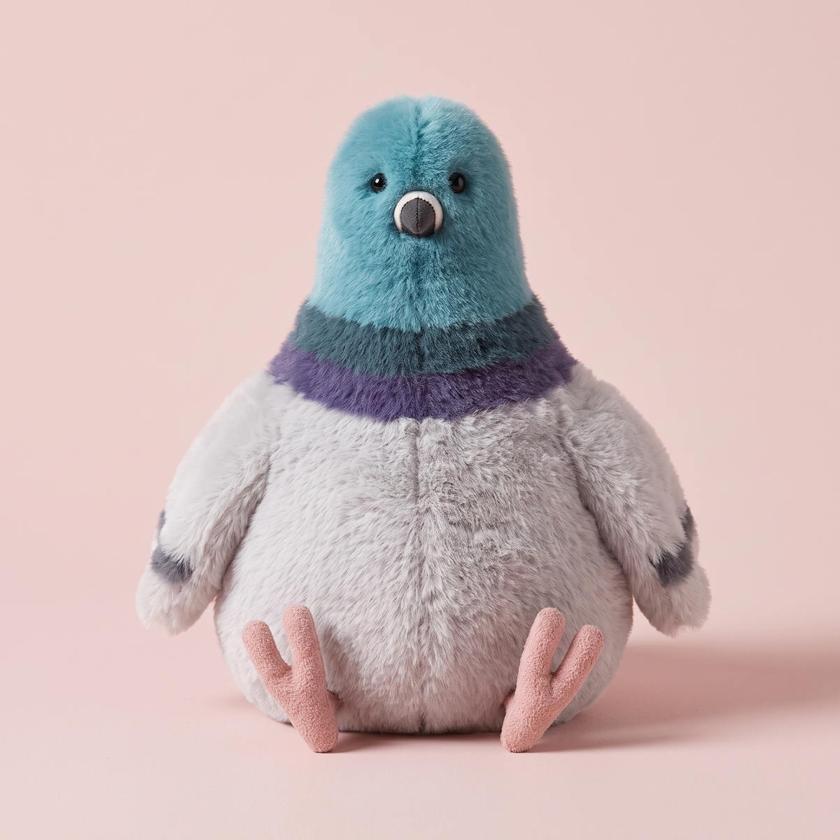 Pigeon Plush Toy front view on a pink studio background