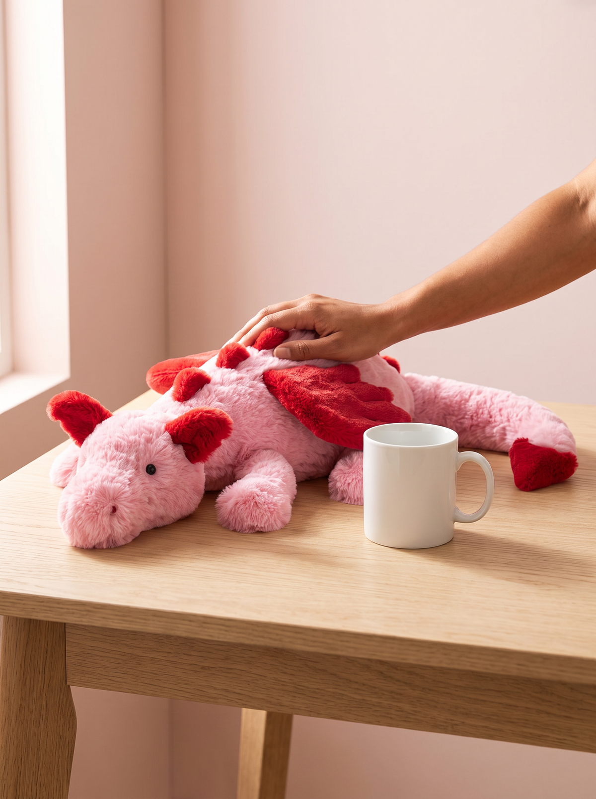 Pink and Red Dragon Plush Toy lifestyle scene