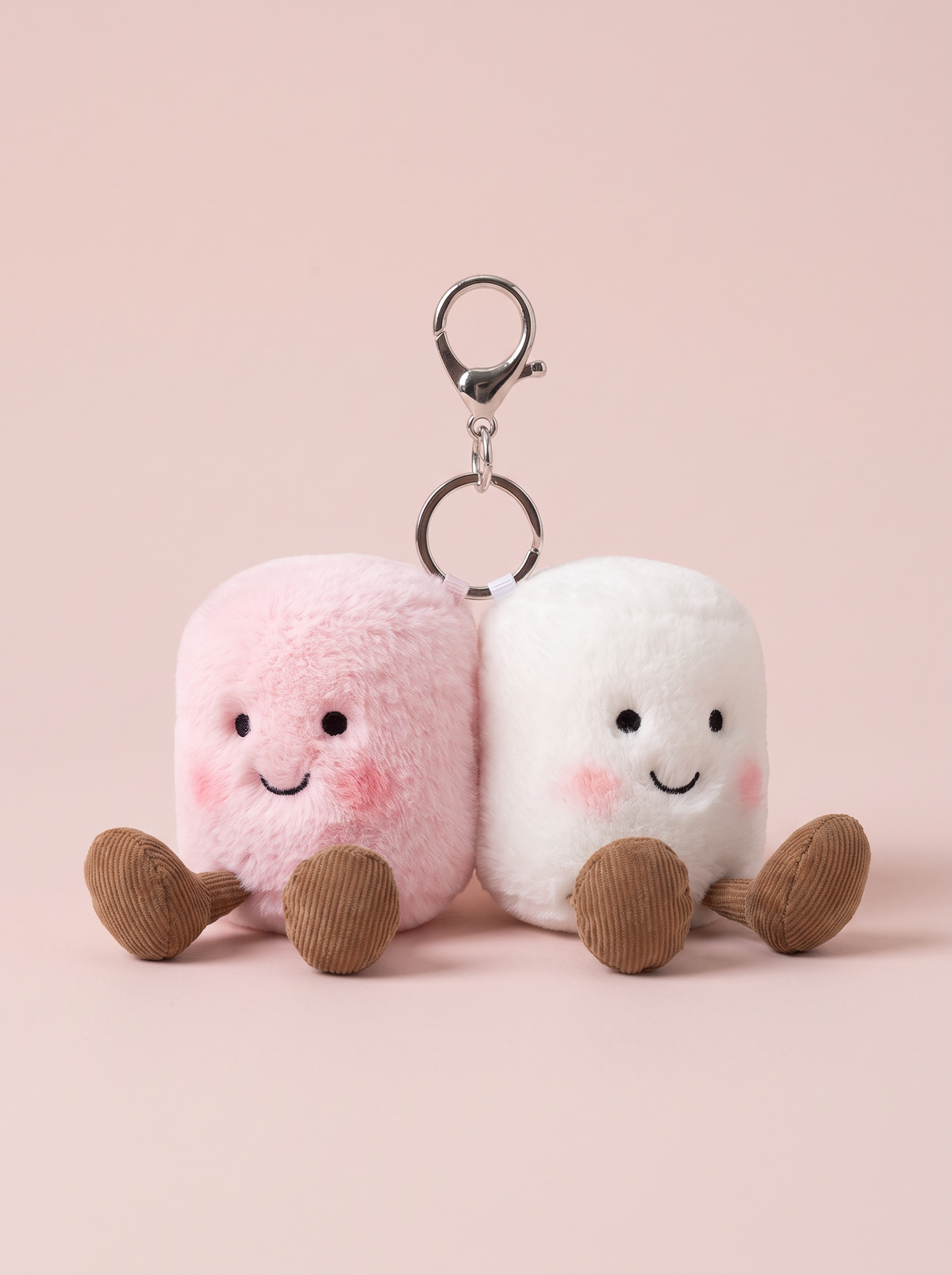 Pink and White Marshmallow Plush Bag Charm front view on a pink studio background