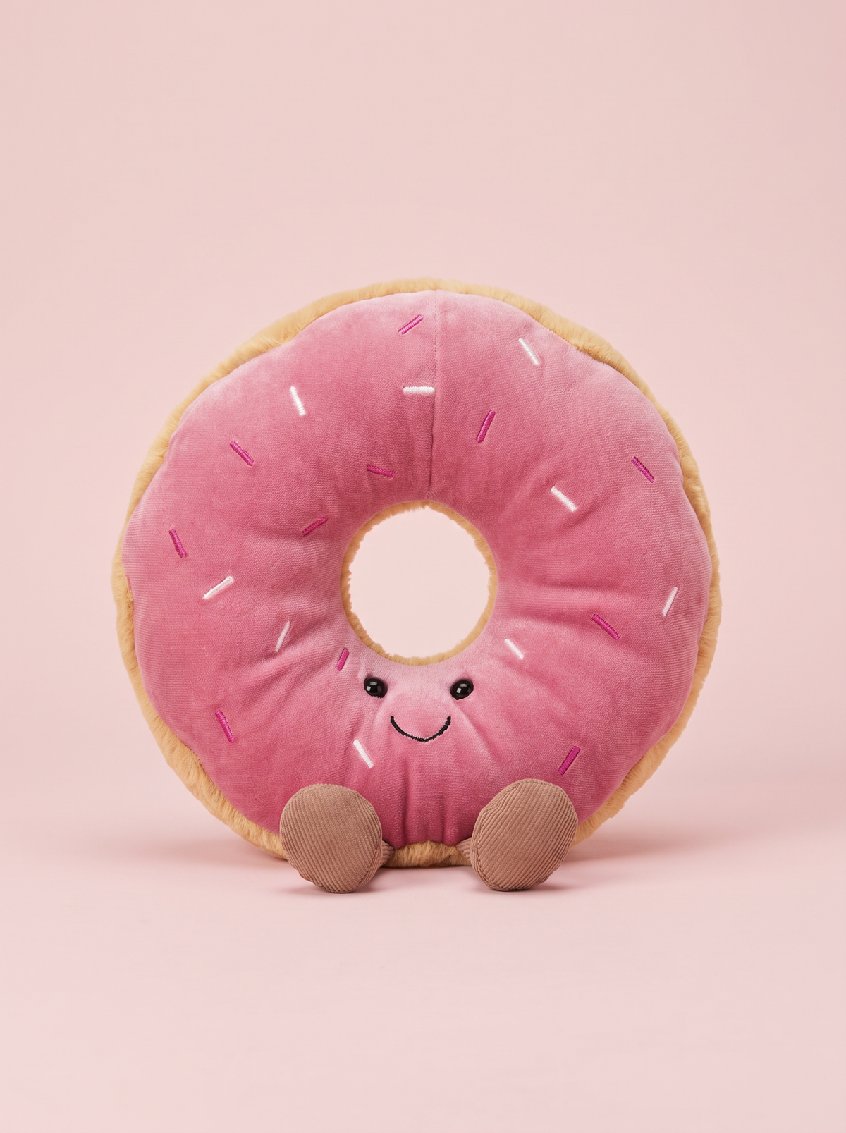 Pink Frosted Doughnut Plush Toy front view on a pink studio background