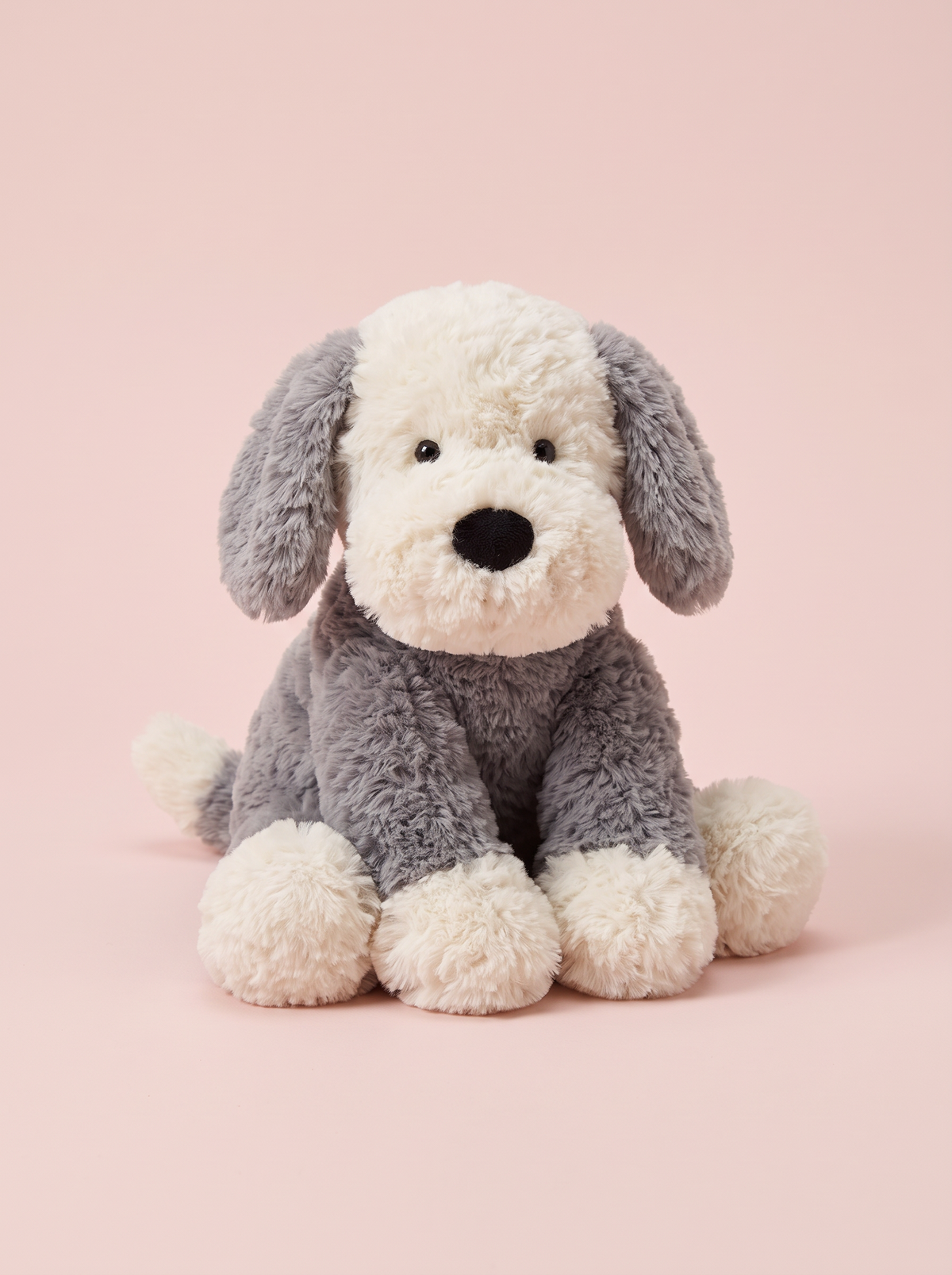Sheepdog Puppy Plush Toy front view on a pink studio background