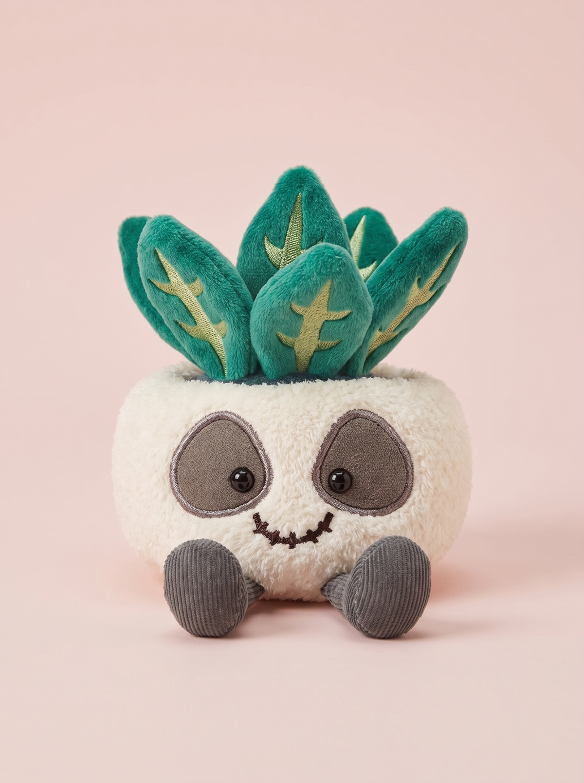 Skull Plant Pot Plush Toy front view on a pink studio background