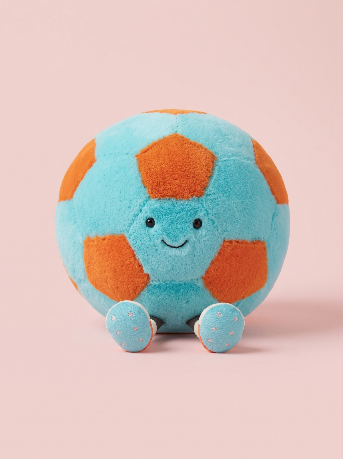 Soccer Ball Plush Toy front view on a pink studio background