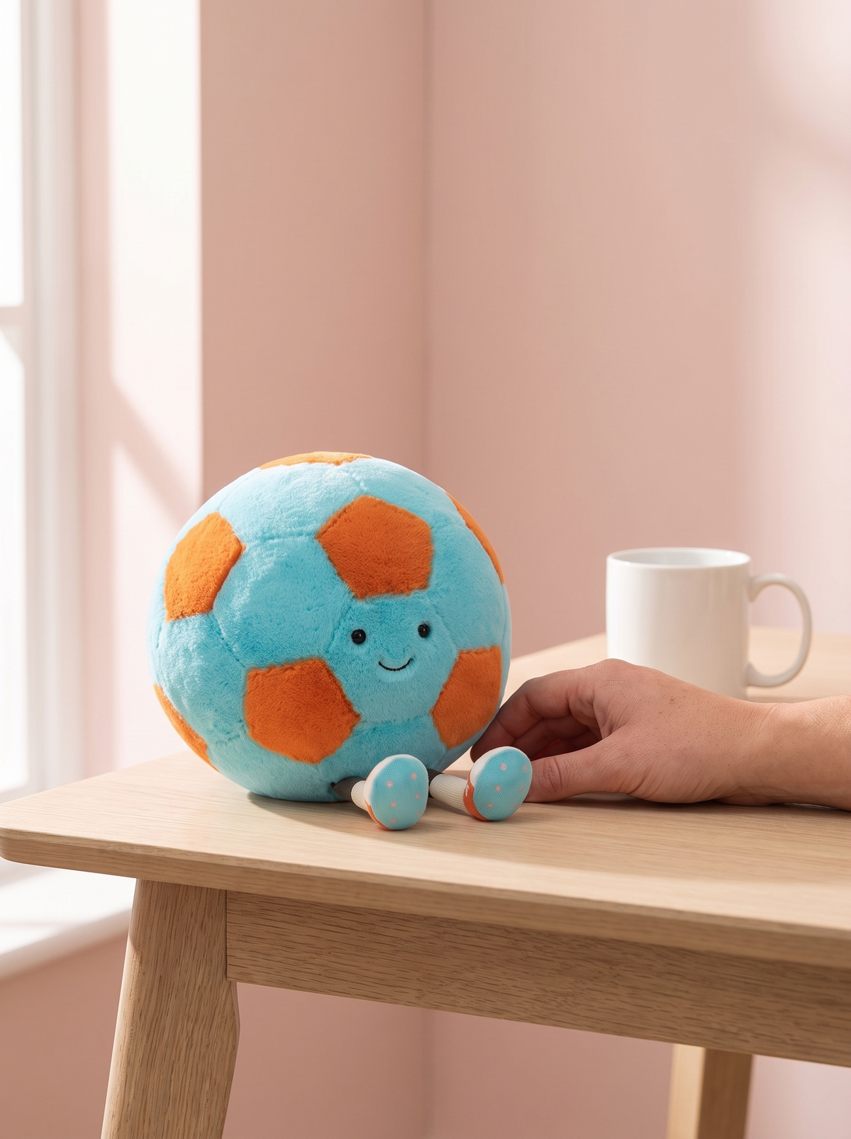 Soccer Ball Plush Toy styled in a home setting