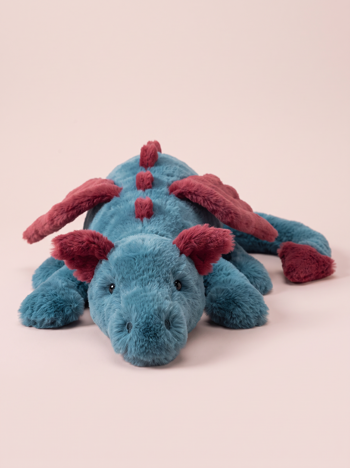 Teal and Red Dragon Plush Toy angled studio view